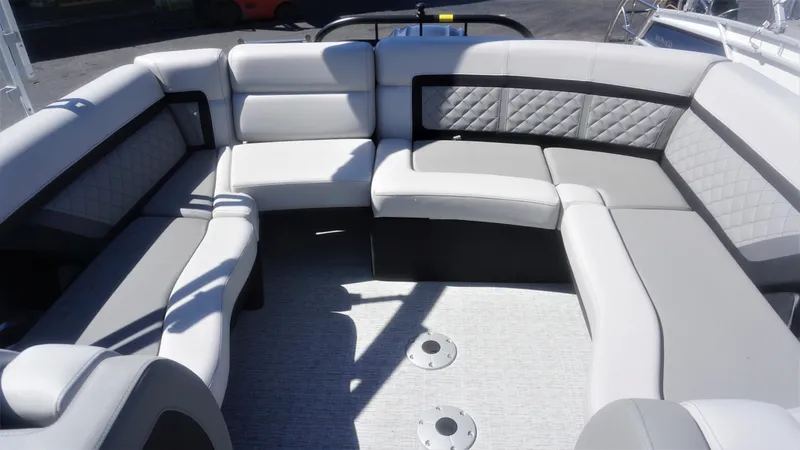 Slide: The Image of 2023 AquaPatio 235 ULC boat interior with luxurious seating and modern design. - 9