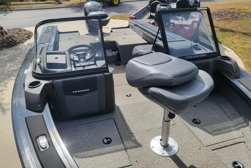 Slide: The Image of 2023 Tracker Targa V-19 WT boat interior with seating and steering console. - 3