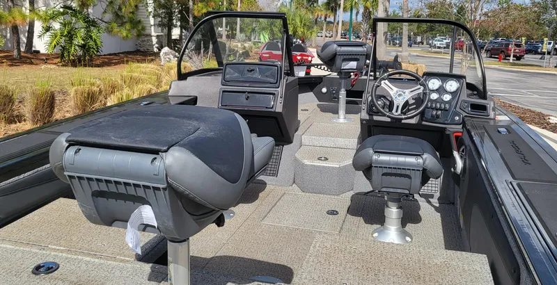 Slide: The Image of 2023 Tracker Targa V-19 WT boat interior with seating and dashboard. - 4