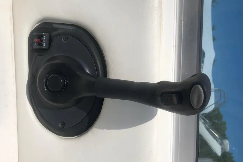 Slide: The Image of Close-up of a 2001 Sea Ray 280 boat throttle control handle. - 11