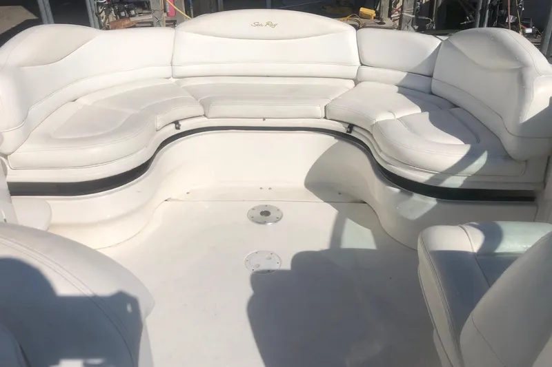 Slide: The Image of 2001 Sea Ray 280 boat interior with white seating arrangement. - 17