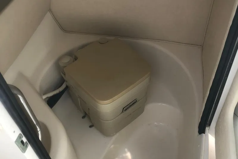Slide: The Image of 2001 Sea Ray 280 boat bathroom with portable toilet. - 5