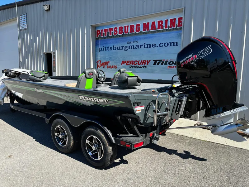 Slide: The Image of 2025 Ranger RT 198P boat at Pittsburg Marine dealership, featuring a powerful outboard motor. - 11