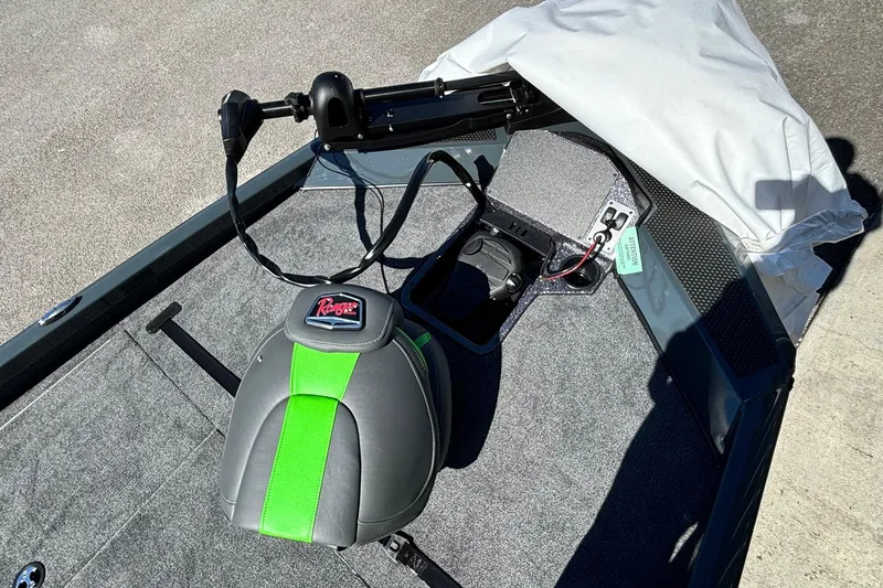 Slide: The Image of 2025 Ranger RT 198P boat interior with green-accented seat and trolling motor. - 3