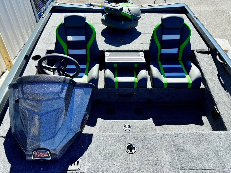 Slide: The Image of 2025 Ranger RT 198P boat interior with dual seats and steering console. - 5