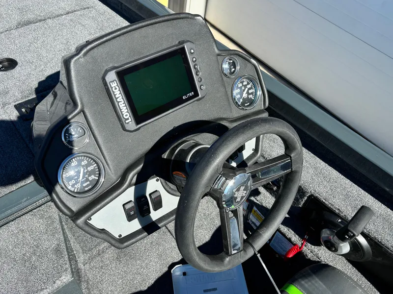 Slide: The Image of 2025 Ranger RT 198P boat dashboard with steering wheel and electronic display. - 6