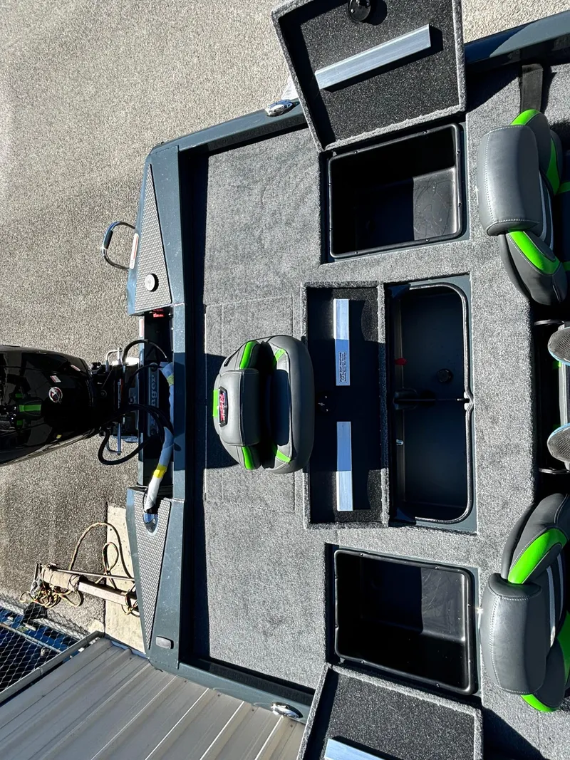 Slide: The Image of 2025 Ranger RT 198P boat interior with open storage compartments and seating. - 8