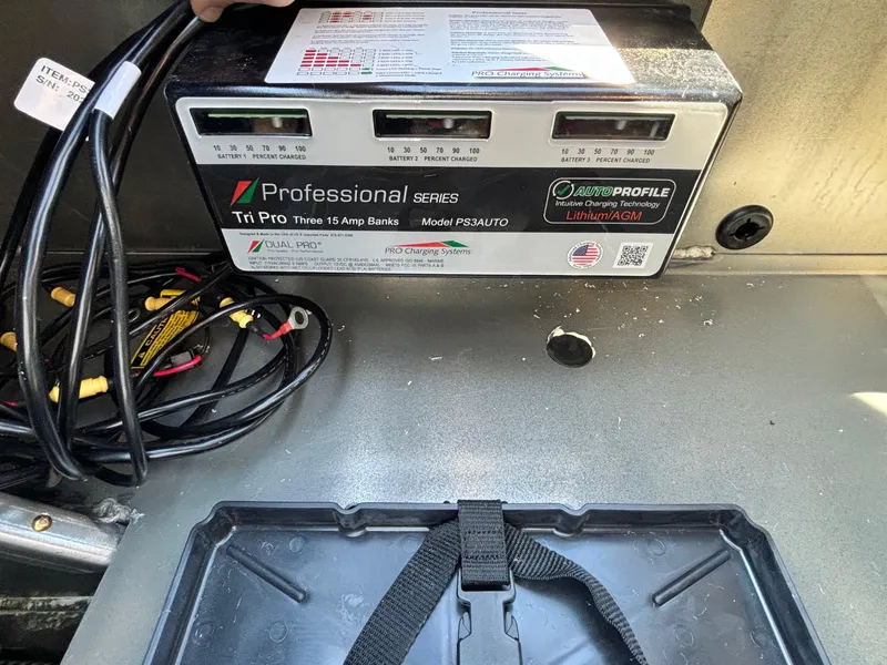 Slide: The Image of Battery charger in a 2025 Ranger RT 198P boat, featuring Tri Pro 15 Amp Bank. - 9