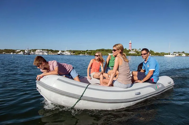 Slide: The Image of Family enjoying a ride on a 2024 AB Inflatables 10 VS boat. - 3