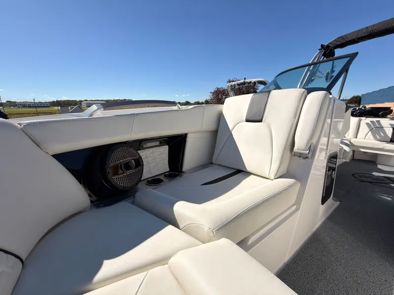 Slide: The Image of The image shows the luxurious white interior of a MasterCraft X22 boat with modern seating. - 49