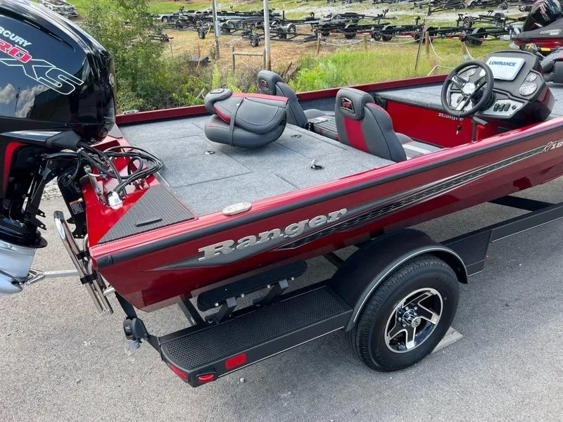 Slide: The Image of 2023 Ranger RT188 boat, red exterior, spacious deck, powerful engine, ideal for fishing. - 11