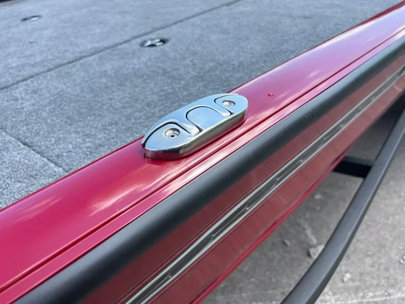 Slide: The Image of 2023 Ranger RT188 boat deck with red trim and metal cleat. - 6