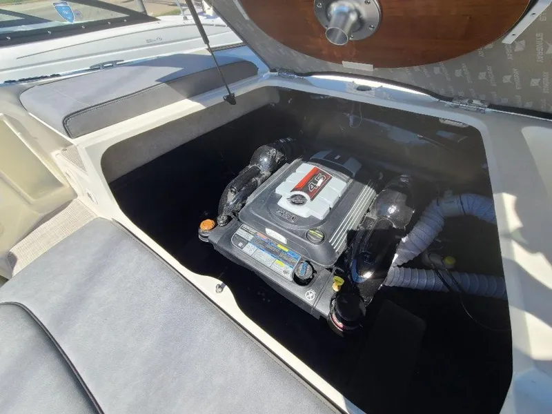 Slide: The Image of 2022 Stingray 215LR boat engine compartment with open hatch. - 3