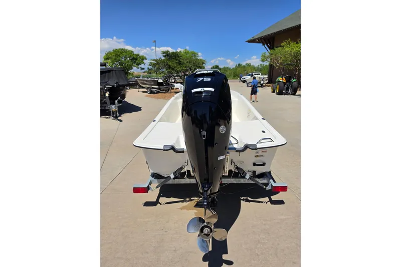 Slide: The Image of 2023 Mako Pro Skiff 17 CC with Mercury 75 engine on trailer. - 5