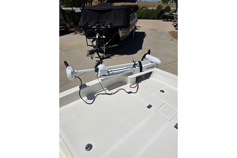 Slide: The Image of 2023 Mako Pro Skiff 17 CC with Minn Kota trolling motor on deck. - 6