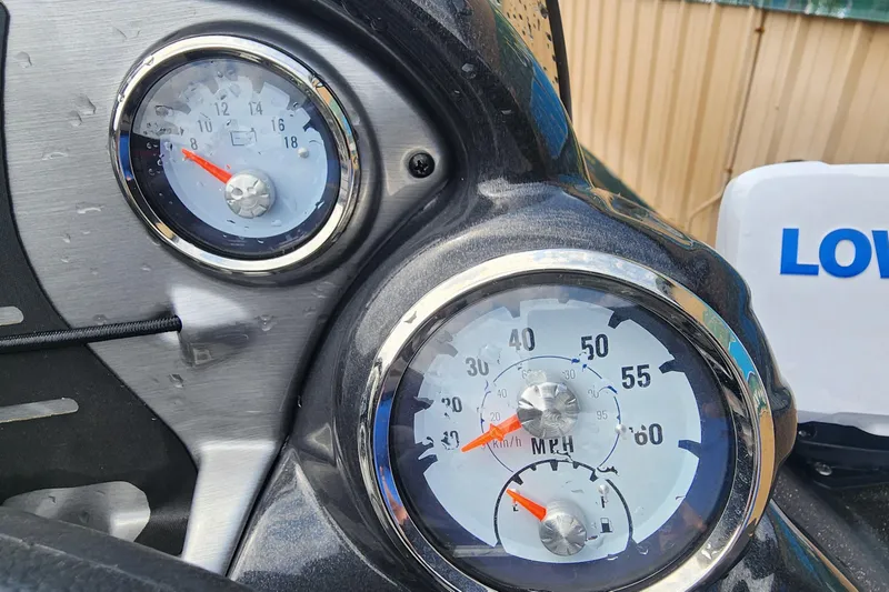 Slide: The Image of Close-up of 2023 Tracker Pro Team 190 TX boat gauges, showing speedometer and tachometer. - 14