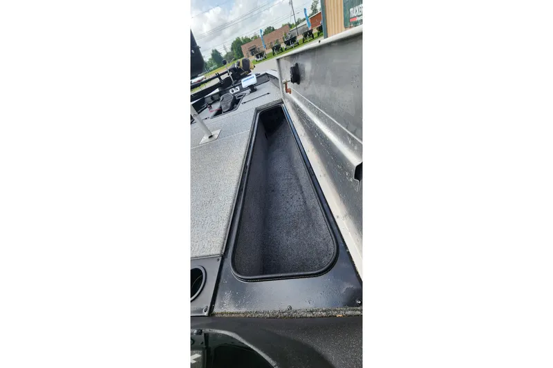 Slide: The Image of 2023 Tracker Pro Team 190 TX boat interior with storage compartment. - 16