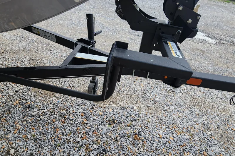 Slide: The Image of Trailer hitch of 2023 Tracker Pro Team 190 TX on gravel surface. - 18