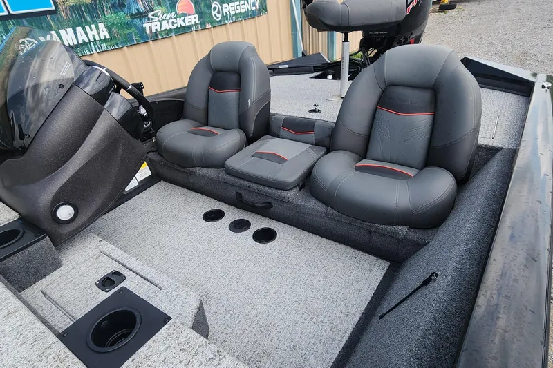 Slide: The Image of 2023 Tracker Pro Team 190 TX boat interior with gray seating and console. - 22