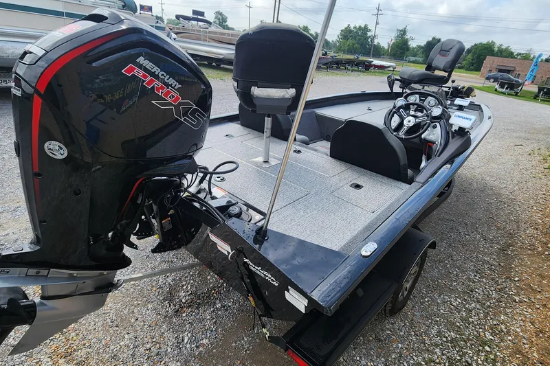 Slide: The Image of 2023 Tracker Pro Team 190 TX boat with Mercury Pro XS engine, parked on gravel. - 7