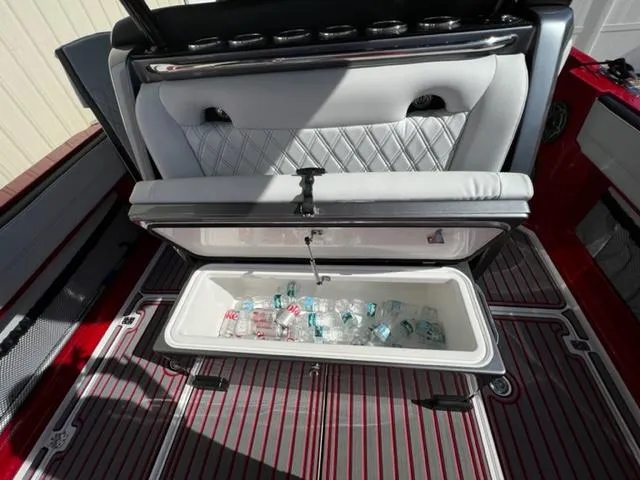 Slide: The Image of Nor-Tech 390 Sport Center Console 2022 with open cooler and drinks on deck. - 11