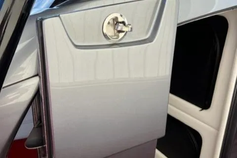 Slide: The Image of 2022 Nor-Tech 390 Sport Center Console storage compartment. - 15