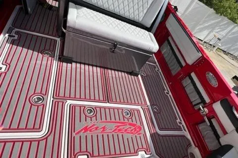 Slide: The Image of 2022 Nor-Tech 390 Sport Center Console interior with custom red and gray flooring. - 16