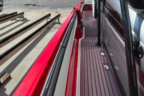 Slide: The Image of 2022 Nor-Tech 390 Sport Center Console, red and gray deck view. - 17