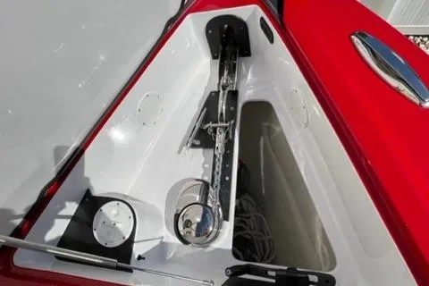Slide: The Image of Anchor compartment of 2022 Nor-Tech 390 Sport Center Console boat. - 19