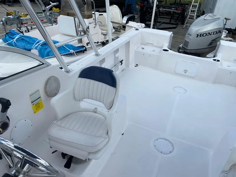 Slide: The Image of 2004 Pro-Line 22DC boat interior with Honda outboard motor. - 11