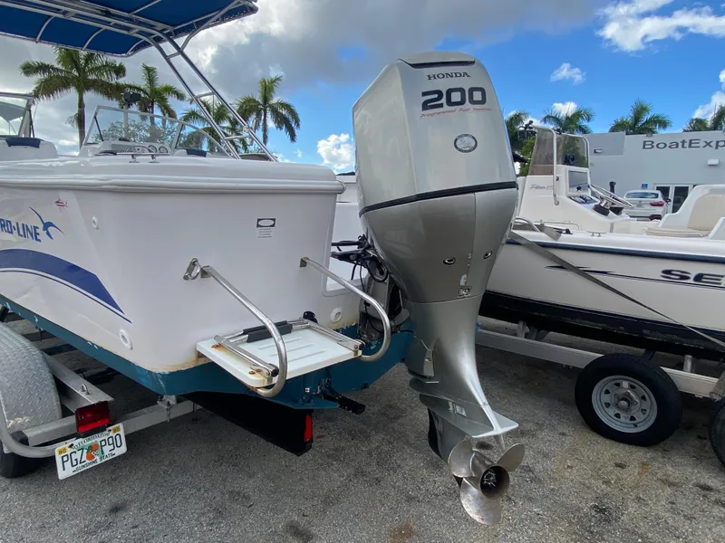 Slide: The Image of 2004 Pro-Line 22DC boat with Honda 200 outboard motor on trailer. - 3