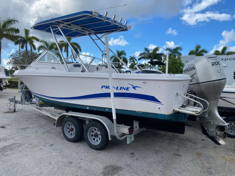 Slide: The Image of 2004 Pro-Line 22DC boat on a trailer with dual Honda outboard motors. - 5
