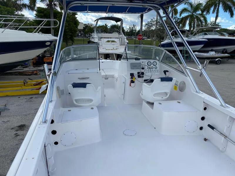 Slide: The Image of 2004 Pro-Line 22DC boat interior with seating and control console. - 6