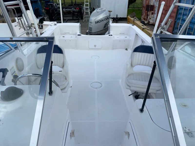 Slide: The Image of 2004 Pro-Line 22DC boat interior with Honda outboard motor. - 9