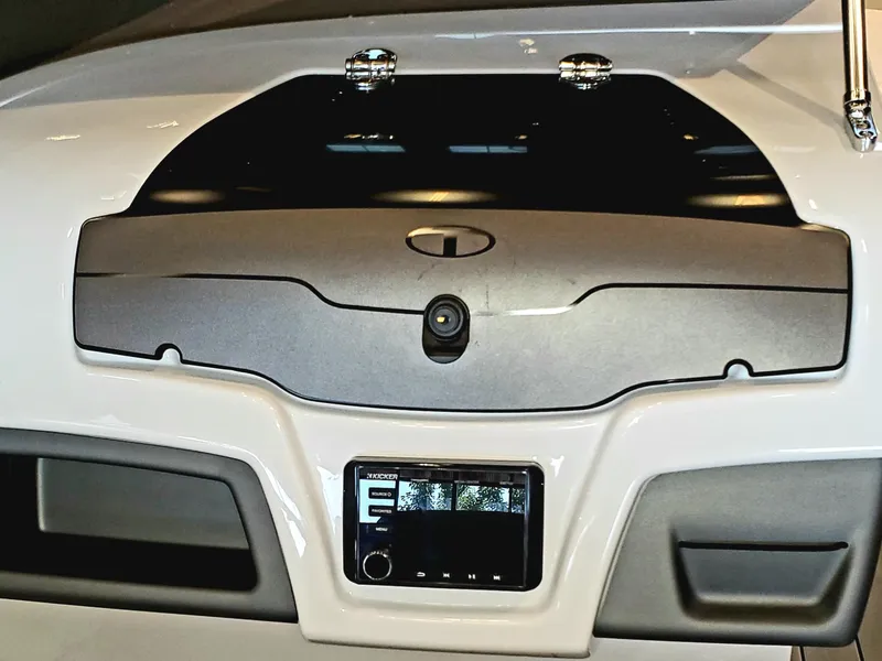 Slide: The Image of 2023 Tahoe 210 Si Limited boat dashboard with control panel and storage compartments. - 3