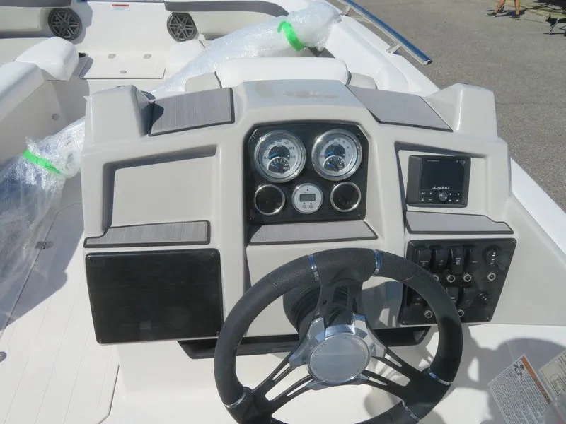 Slide: The Image of 2023 Starcraft SVX OB 211 OB boat dashboard with steering wheel and gauges. - 10