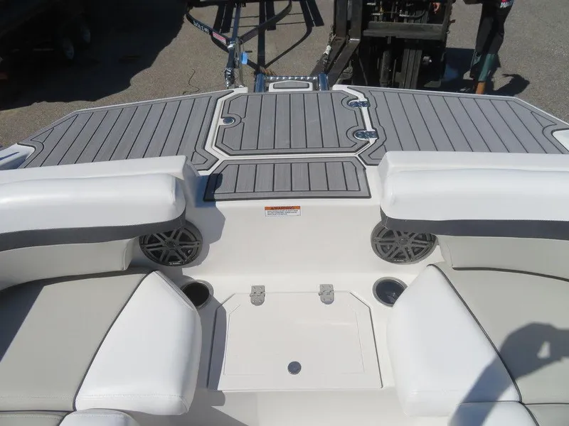 Slide: The Image of 2023 Starcraft SVX OB 211 OB boat interior with seating and speakers. - 14