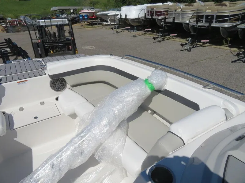 Slide: The Image of 2023 Starcraft SVX OB 211 OB boat interior with bubble-wrapped item on seat. - 15