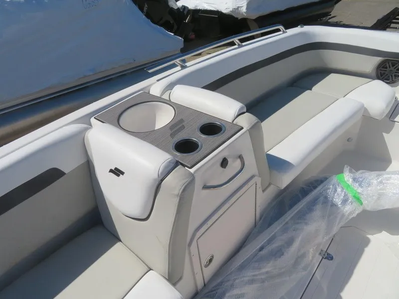 Slide: The Image of 2023 Starcraft SVX OB 211 OB boat interior with seating and cup holders. - 5