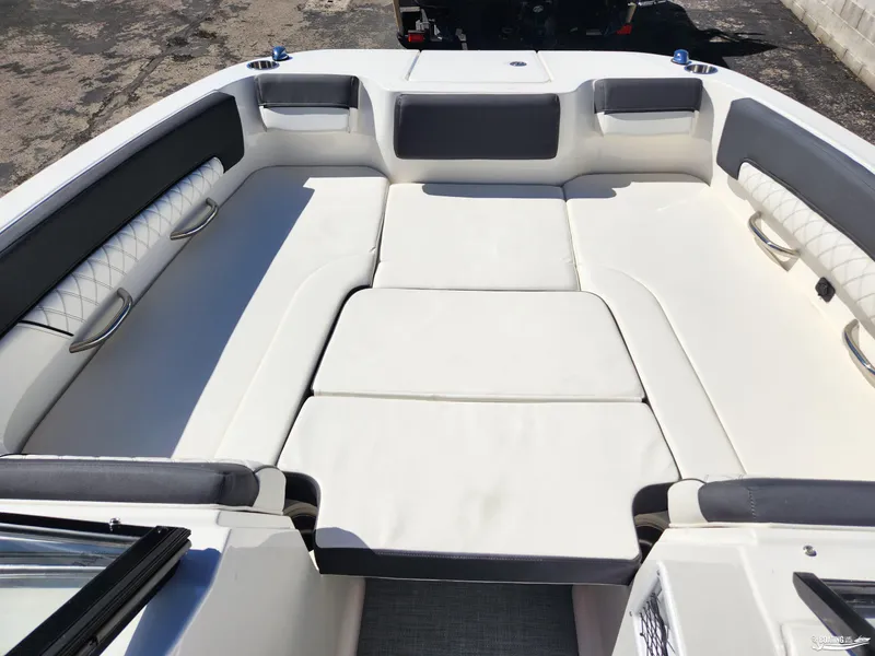Slide: The Image of 2023 Bayliner DX2250 boat interior with spacious seating and modern design. - 25