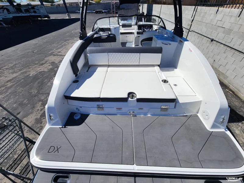 Slide: The Image of 2023 Bayliner DX2250 boat with spacious seating and modern design. - 6