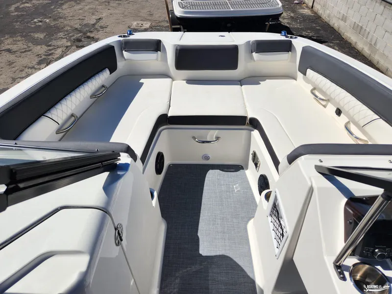 Slide: The Image of 2023 Bayliner DX2250 boat interior with spacious seating and modern design. - 7