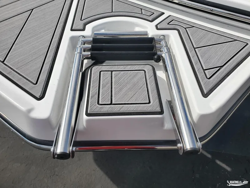 Slide: The Image of 2023 Monterey M22 boat swim platform with stainless steel ladder and textured decking. - 16