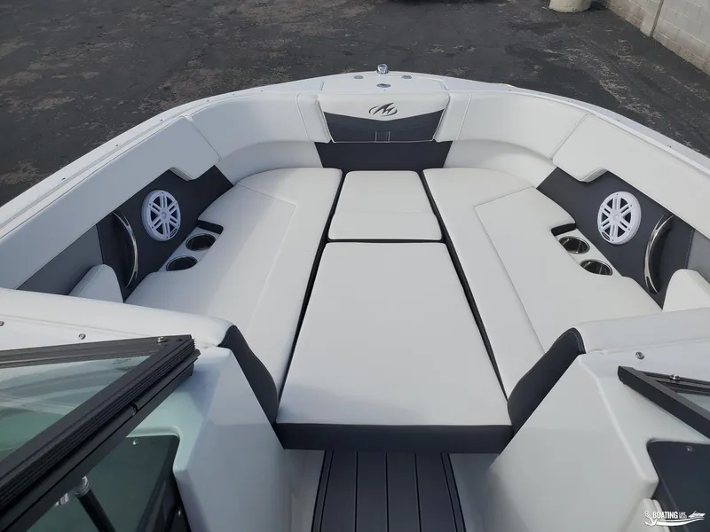 Slide: The Image of 2023 Monterey M22 boat interior with white seating and built-in speakers. - 4