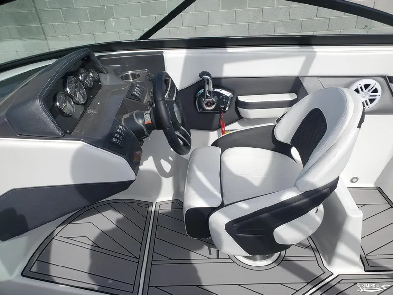 Slide: The Image of 2023 Monterey M22 boat cockpit with modern steering and controls. - 7