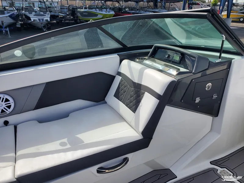 Slide: The Image of 2023 Monterey M22 boat interior with sleek seating and modern dashboard. - 8