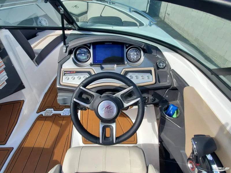 Slide: The Image of 2023 Monterey 238SS boat dashboard with steering wheel and control panel. - 10