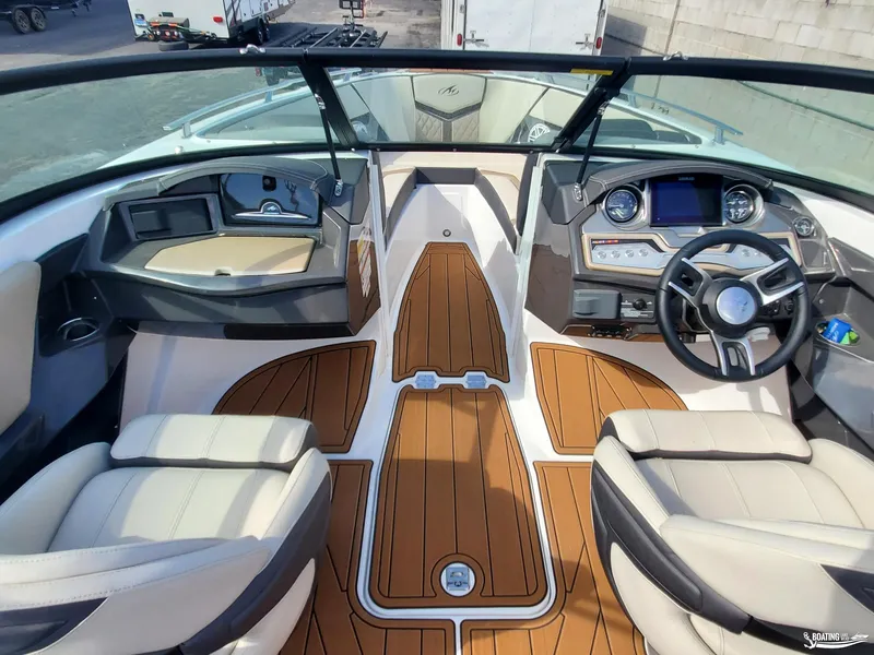 Slide: The Image of 2023 Monterey 238SS boat interior with modern dashboard and seating. - 12