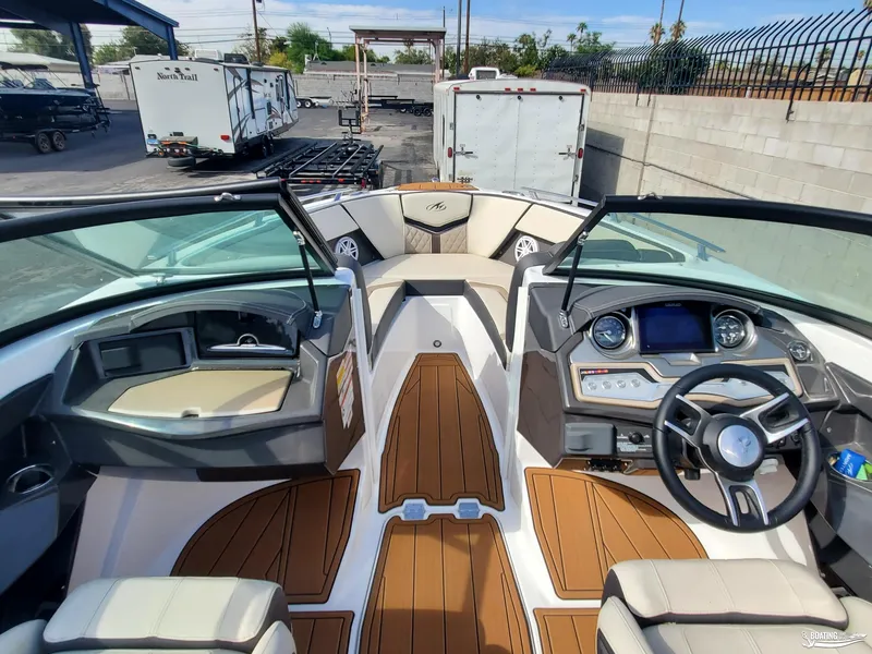 Slide: The Image of 2023 Monterey 238SS boat interior with modern dashboard and seating. - 13