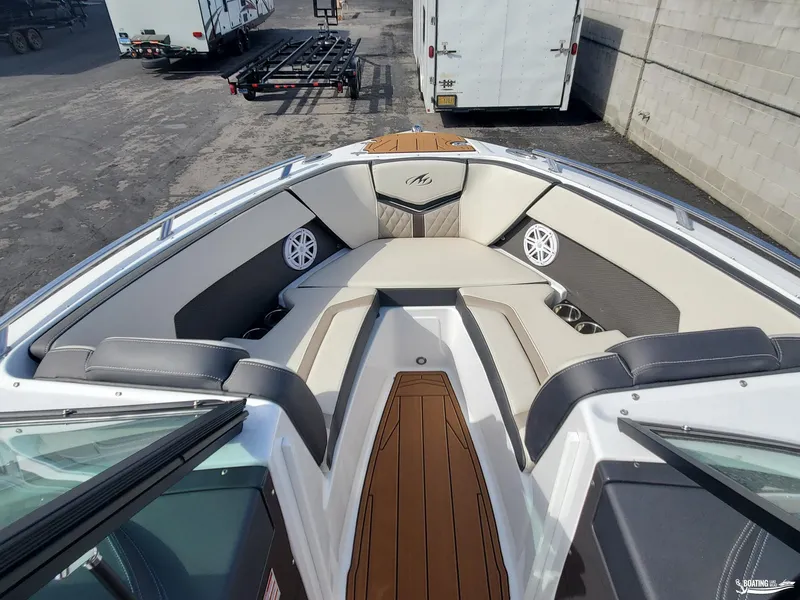 Slide: The Image of 2023 Monterey 238SS boat interior with cushioned seating and speakers. - 14